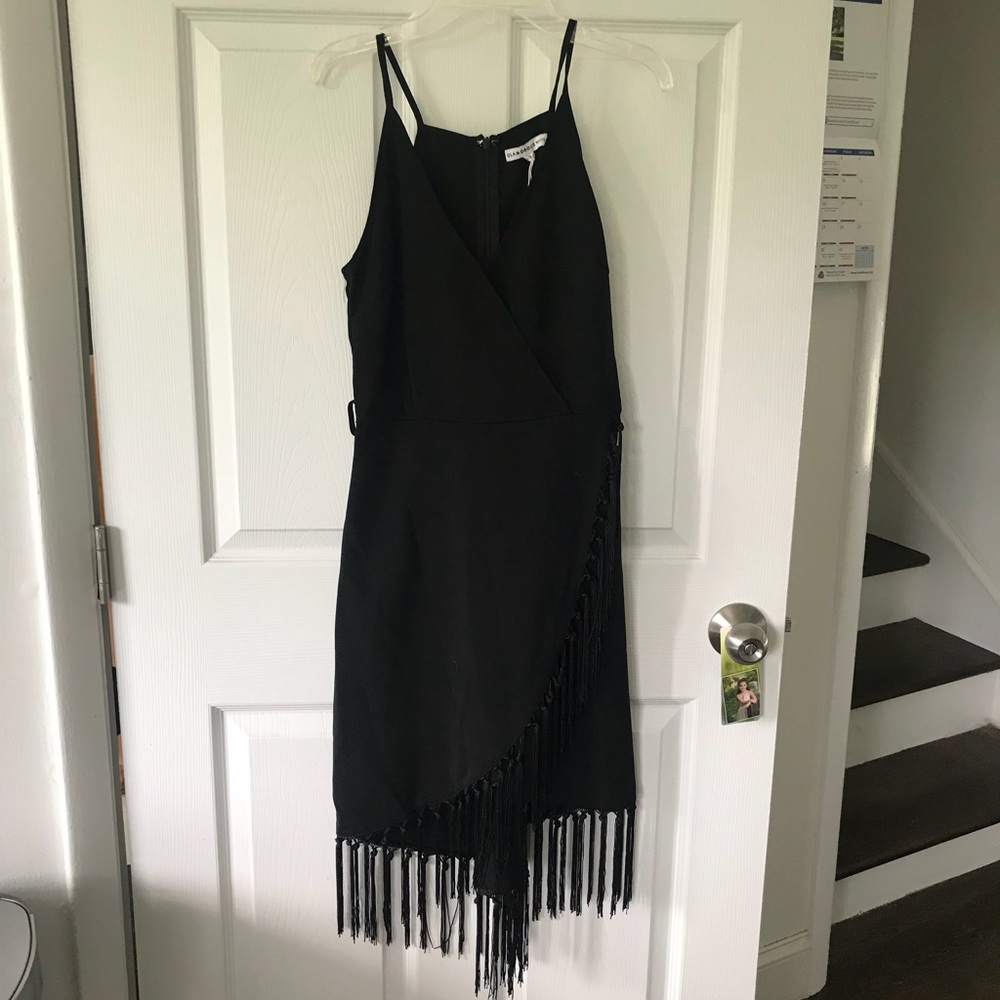 Black fringe faux wrap dress